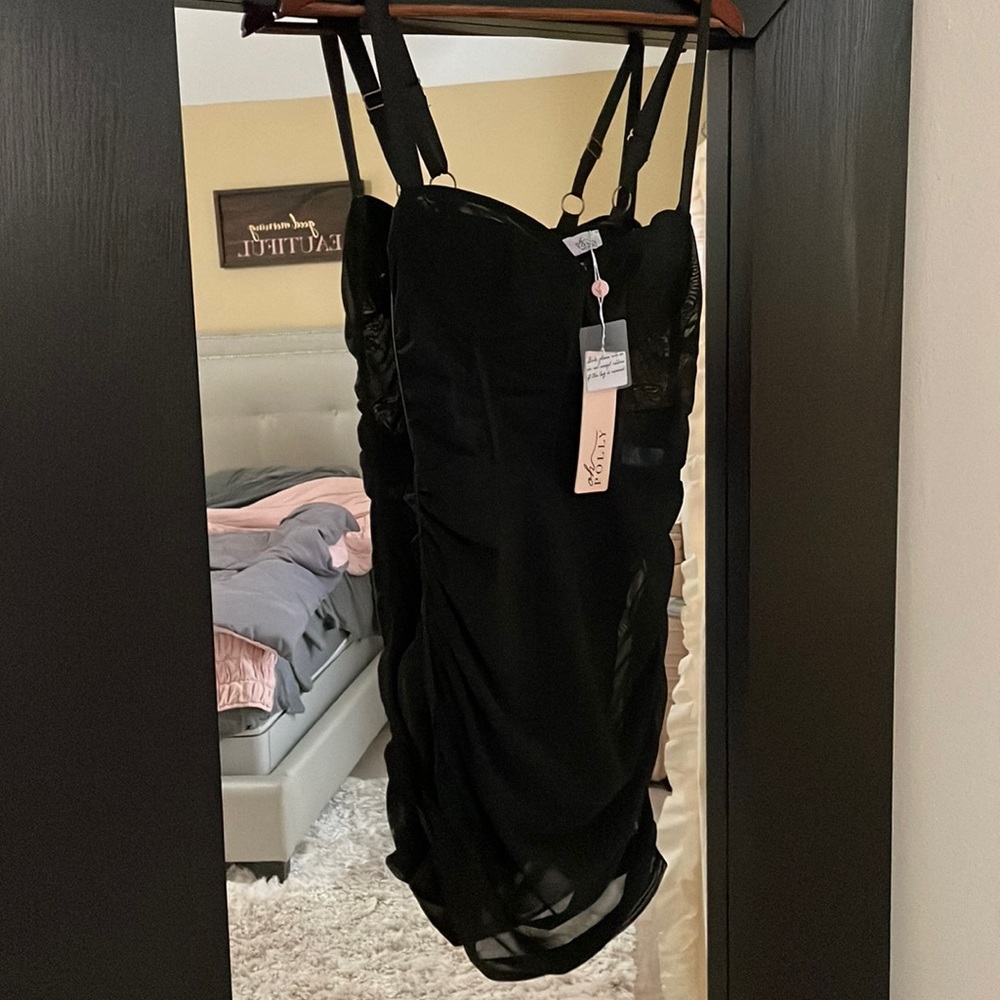 Mesh corseted little black dress size 6. Oh Polly.